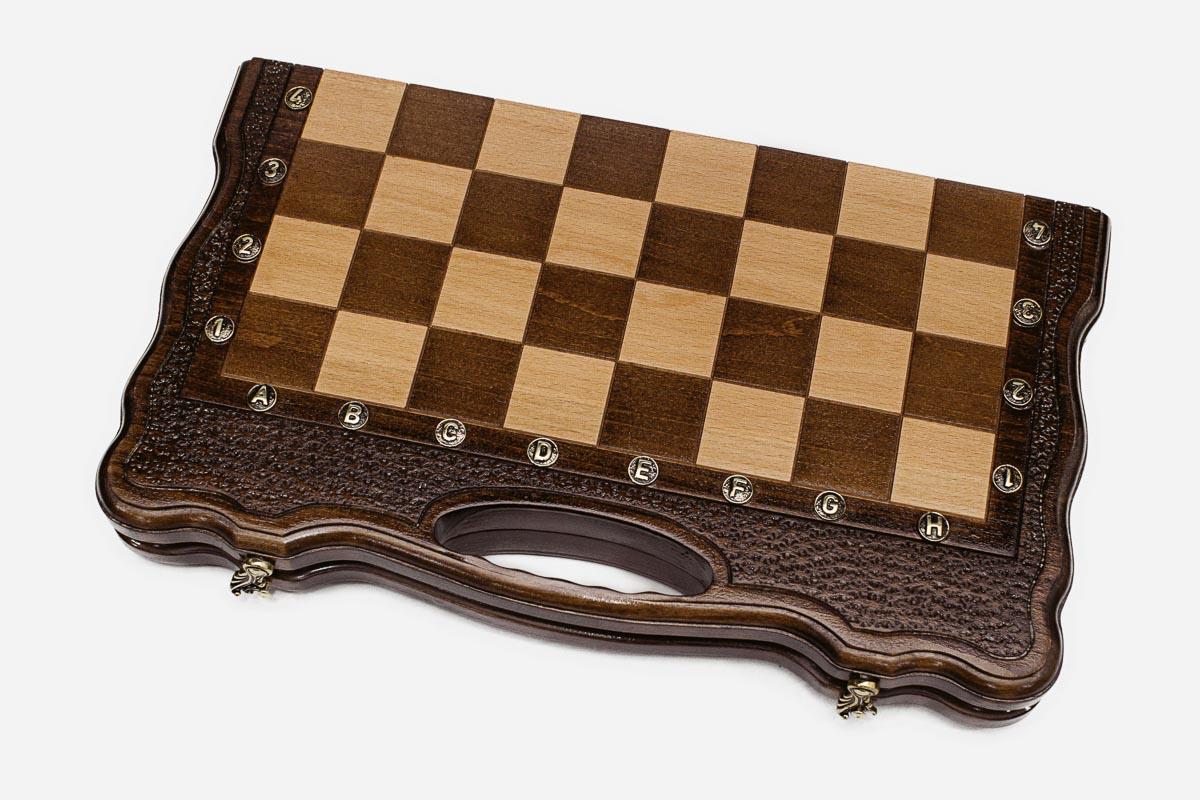 Angled view of the scalloped walnut frame and the built-in carry handle