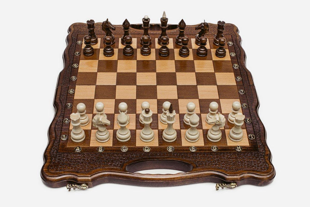 Close-up of the turned chess pieces on the maple and walnut inlaid squares