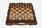 Close-up of the turned chess pieces on the maple and walnut inlaid squares