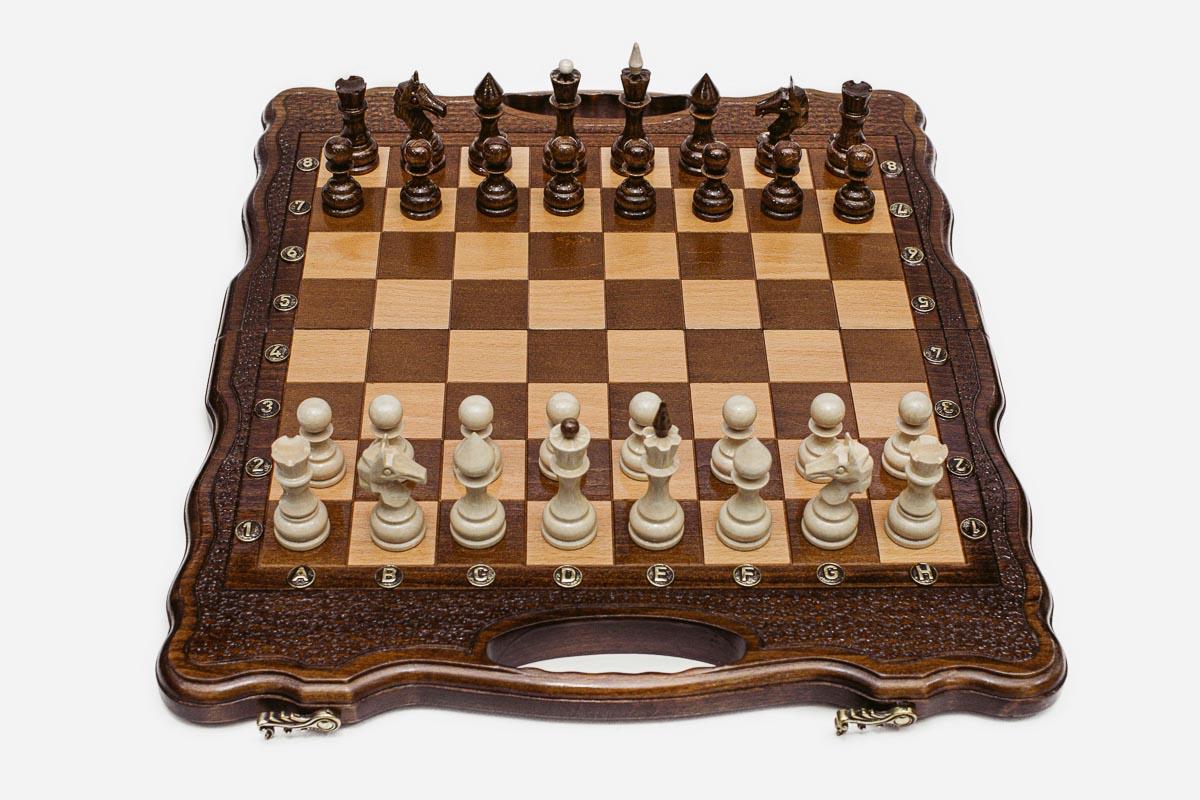 Close-up of the turned chess pieces on the maple and walnut inlaid squares
