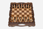 Luxury walnut chess set with carved corners and ornate bronze pieces, the gilded and darkened armies in starting position