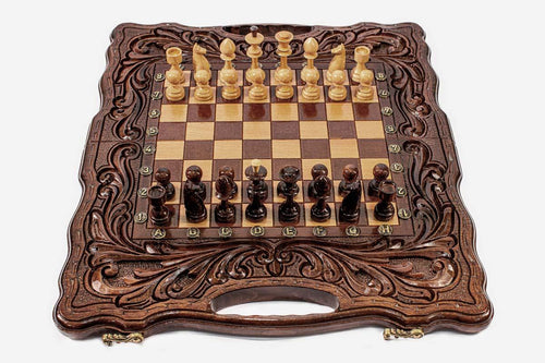 Acanthus travel chess and backgammon set with turned wooden pieces set up and a carry handle at each end