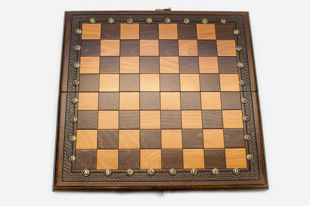 Classic carved border cut by hand on a wooden chess board - detail