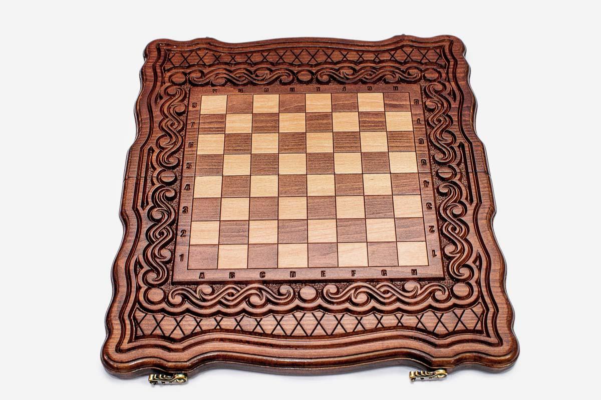Classic wooden chess set folded with bronze hinges and clasps