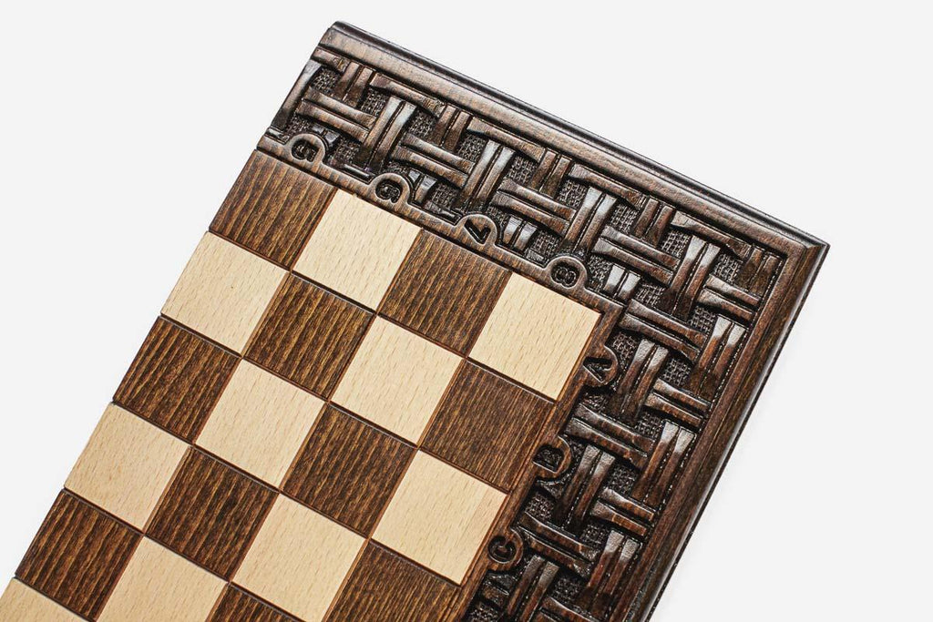 Hand-carved lattice frame on a wooden chess set - side view