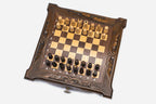 Angled top view of the compact dark walnut chess board with pieces arranged for play
