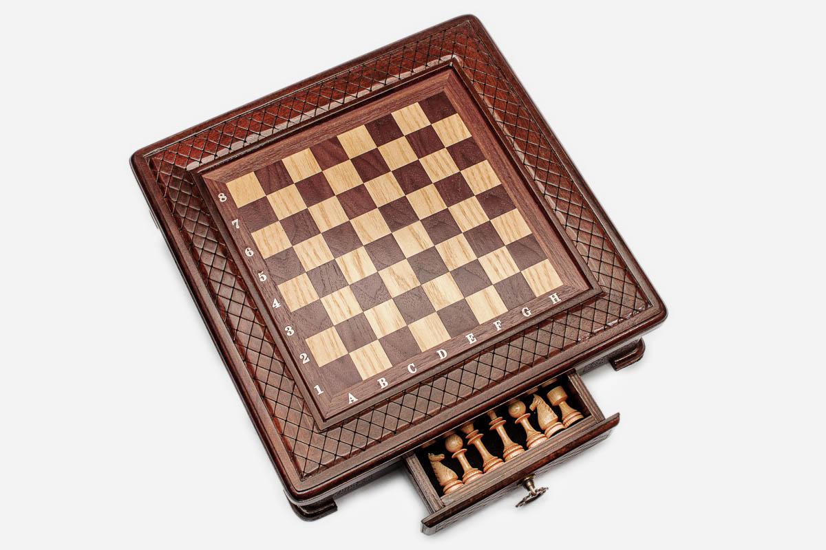 Compact chess set with a side storage drawer open revealing the light wooden pieces