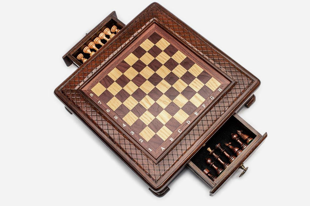 Compact chess set with both side drawers pulled out showing the light and dark pieces stored inside