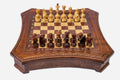 Curved-side wooden chess set with diamond-lattice border and wooden pieces set up on the inlaid board