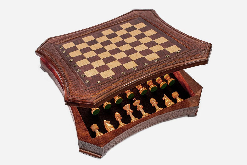 Curved-side chess set with the storage drawer open showing the green-felted wooden pieces inside