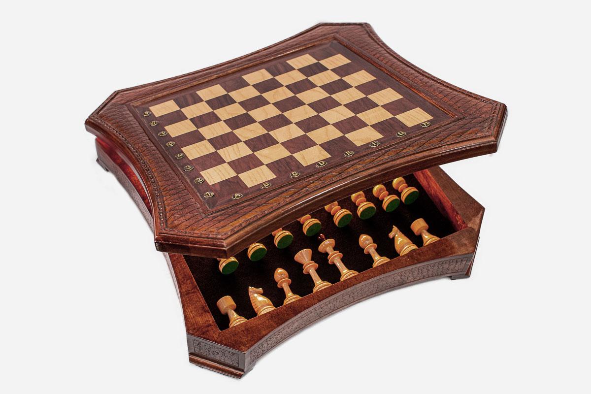 Curved-side chess set with the storage drawer open showing the green-felted wooden pieces inside