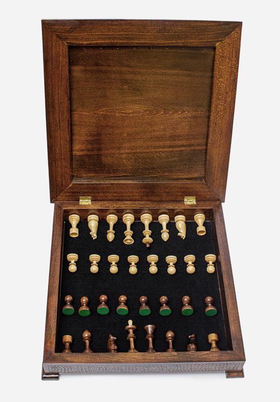 Dark walnut chess set with the storage drawer open showing the light wooden pieces inside