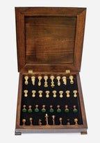Dark walnut chess set with the storage drawer open showing the light wooden pieces inside