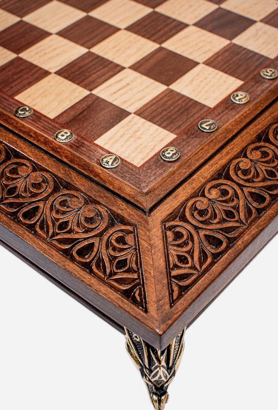 Close-up of the chess board's openwork filigree corner carving and cast-bronze foot