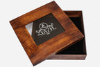 Wooden presentation box open beside the carved chess board