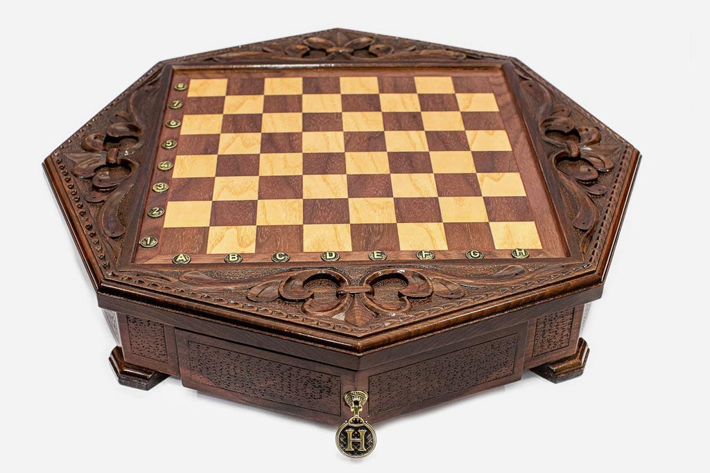 Octagonal wooden chess board shown from the front with carved border and inlaid checkered surface