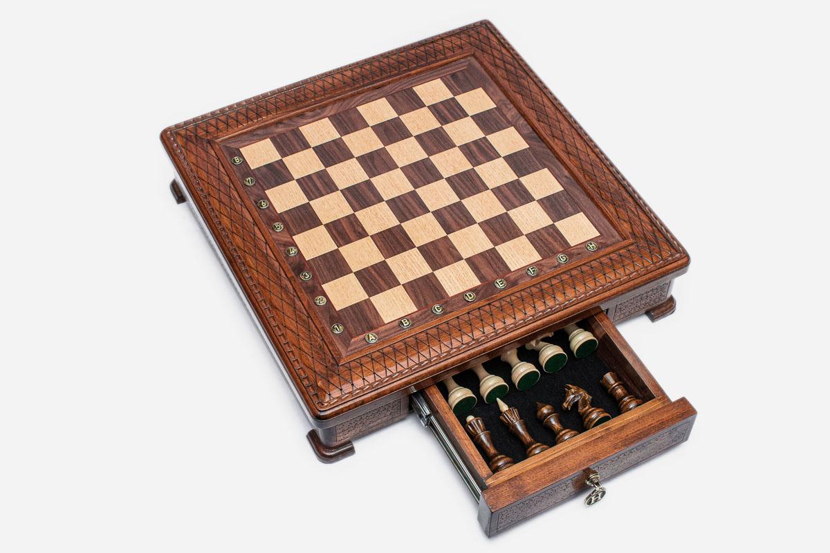 Square chess set with the storage drawer open showing the wooden pieces inside