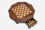 Mahogany octagonal chess board with the storage drawer open, viewed from above