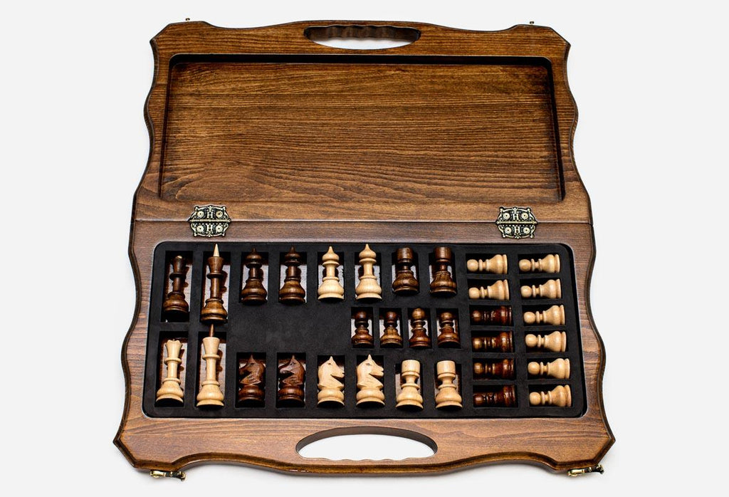 Overhead view of the full-size chess board and the complete set of 32 pieces