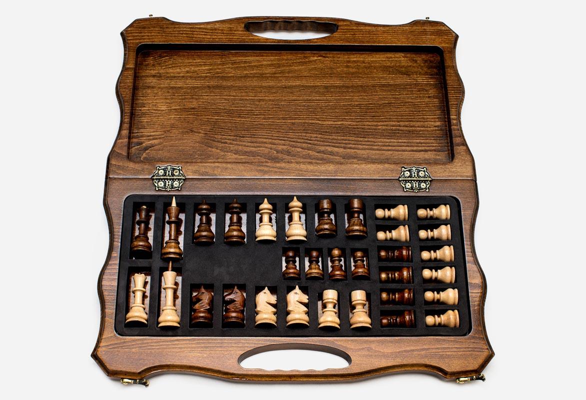 Overhead view of the full-size chess board and the complete set of 32 pieces