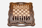 Armenian walnut chess set with a Mount Ararat inlay and carved frame, pieces in starting position