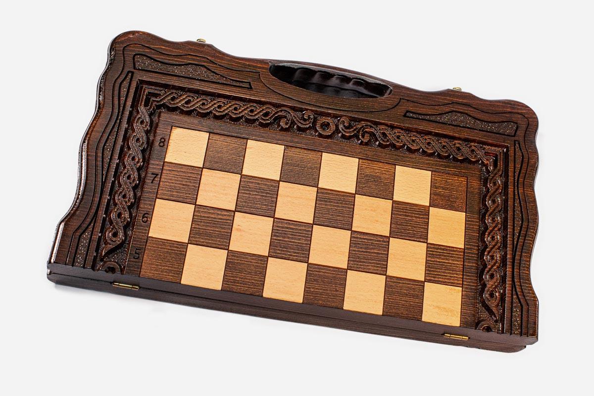 Classic carved border on a large wooden chess board - detail