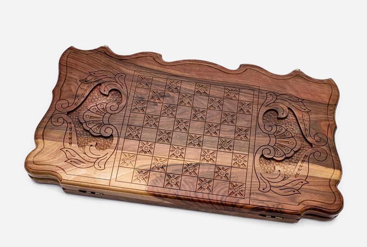 Carved reverse face of walnut Armenian backgammon set with fantail birds