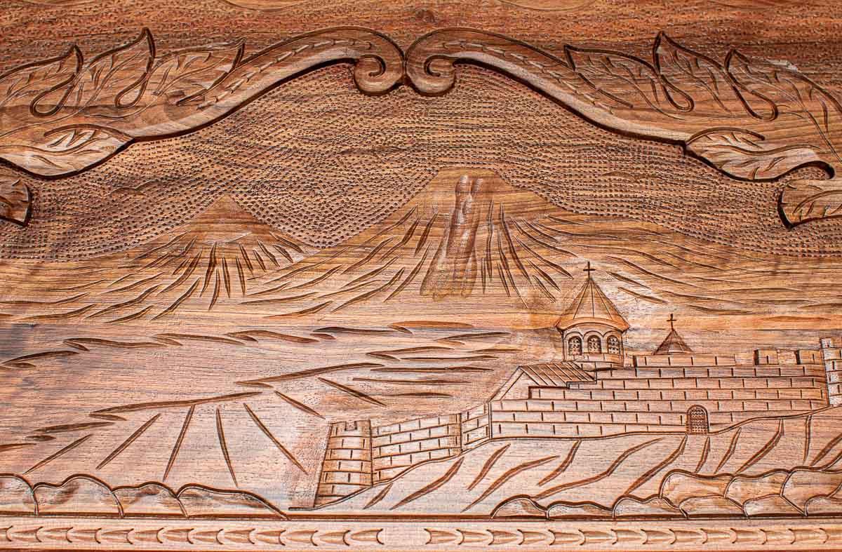 Hand-carved Khor Virap monastery and Ararat peaks detail in walnut