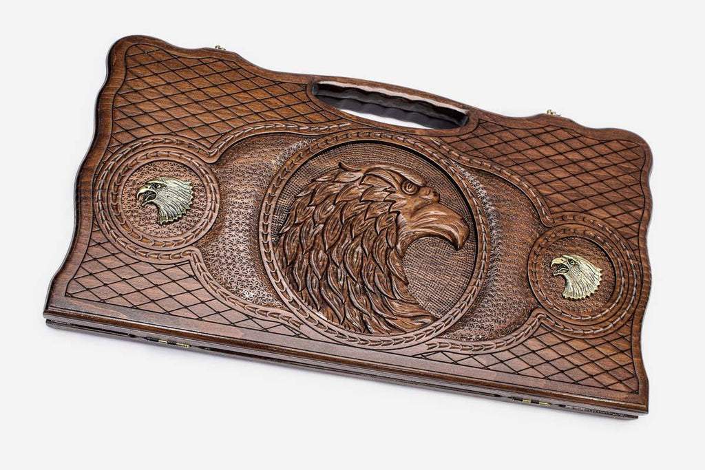 Carved beechwood backgammon board with a bronze-accented eagle, propped open