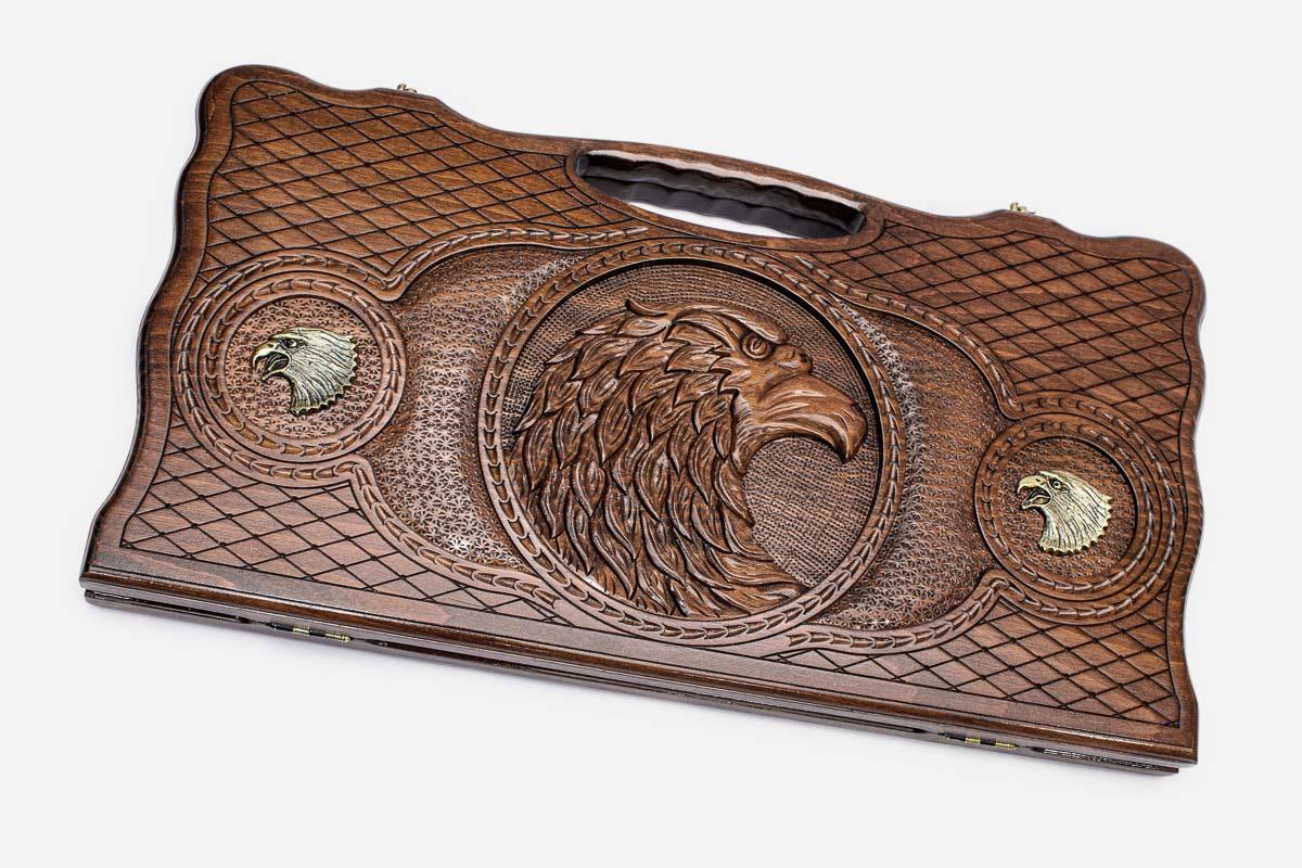 Carved beechwood backgammon board with a bronze-accented eagle, propped open