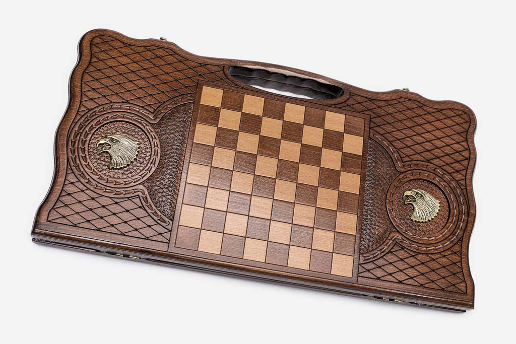 Angled view of the bronze eagle carved backgammon board