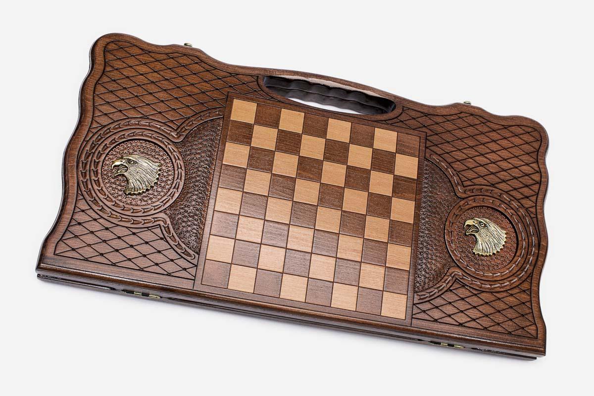 Angled view of the bronze eagle carved backgammon board