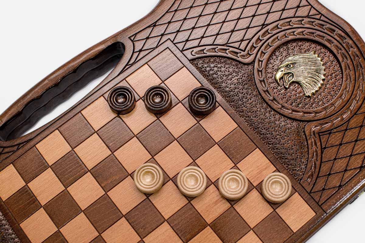 The backgammon board opened to show the wooden playing surface