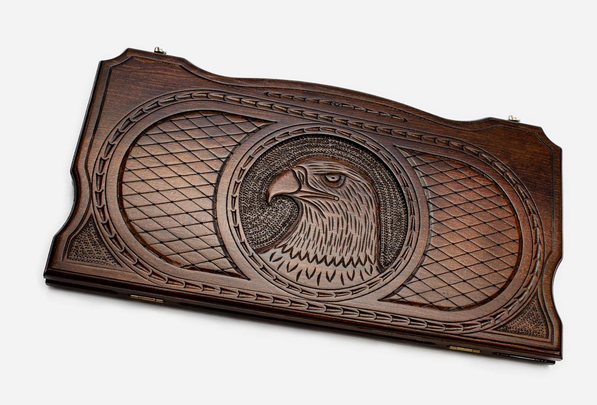 Hand-carved eagle on wooden backgammon set lid