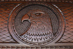 Close-up of hand-carved eagle head in stippled beech