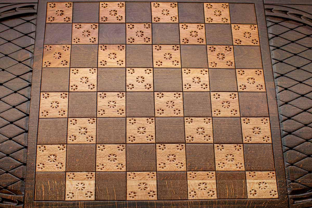 Carved flower details on reverse face of eagle backgammon set