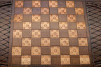 Carved flower details on reverse face of eagle backgammon set
