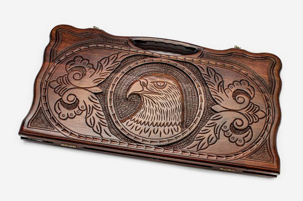 Carved beechwood backgammon board with a soaring eagle and carry handle, propped open
