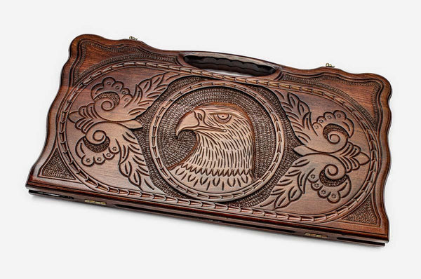 Carved beechwood backgammon board with a soaring eagle and carry handle, propped open