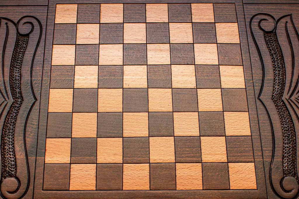 The backgammon board opened to show the wooden playing surface
