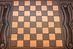The backgammon board opened to show the wooden playing surface