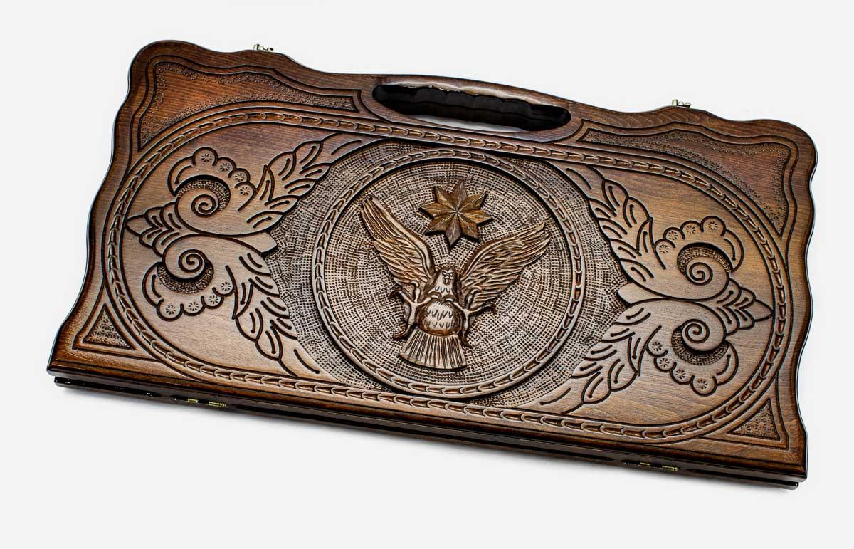 Carved beechwood backgammon board with an eagle and an octagon star, propped open