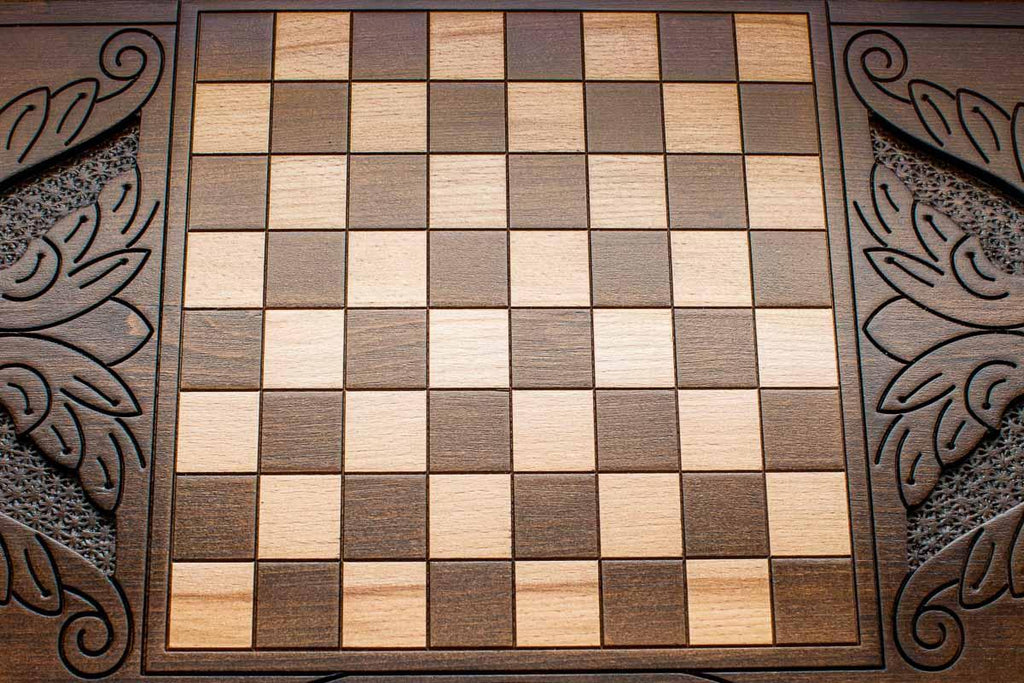 The backgammon board opened to show the wooden playing surface