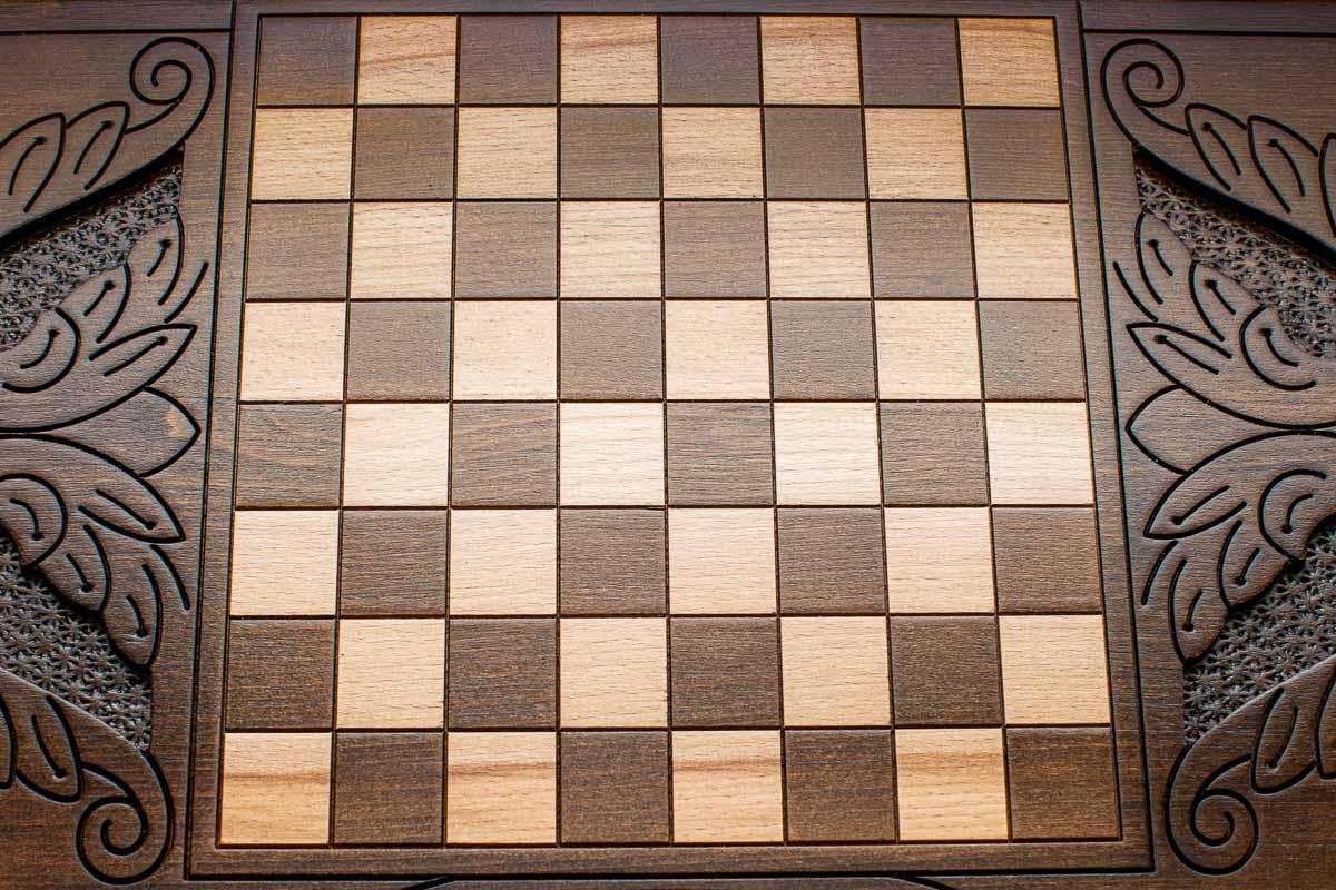 The backgammon board opened to show the wooden playing surface