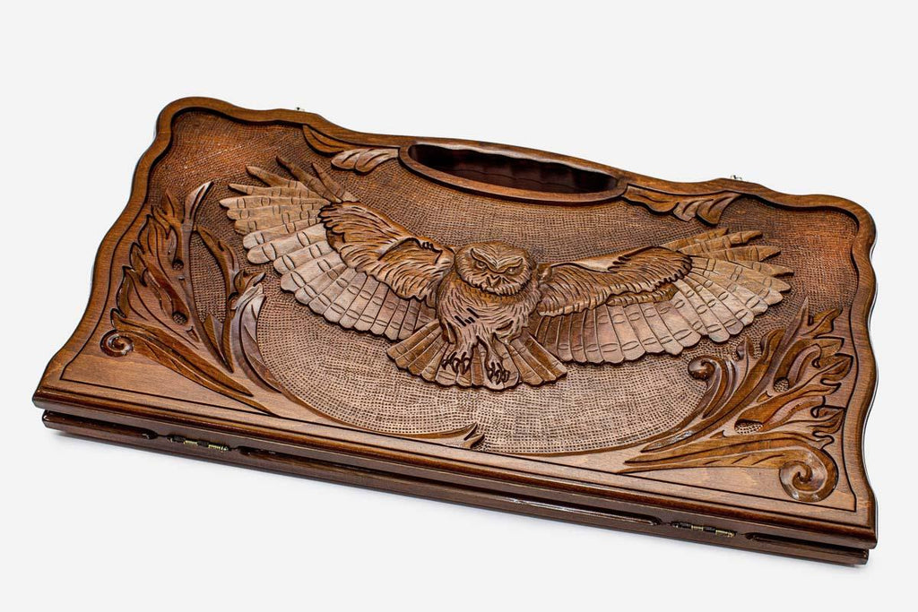 Carved beechwood backgammon board with an owl and carry handle, propped open
