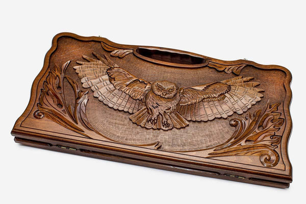 Carved beechwood backgammon board with an owl and carry handle, propped open