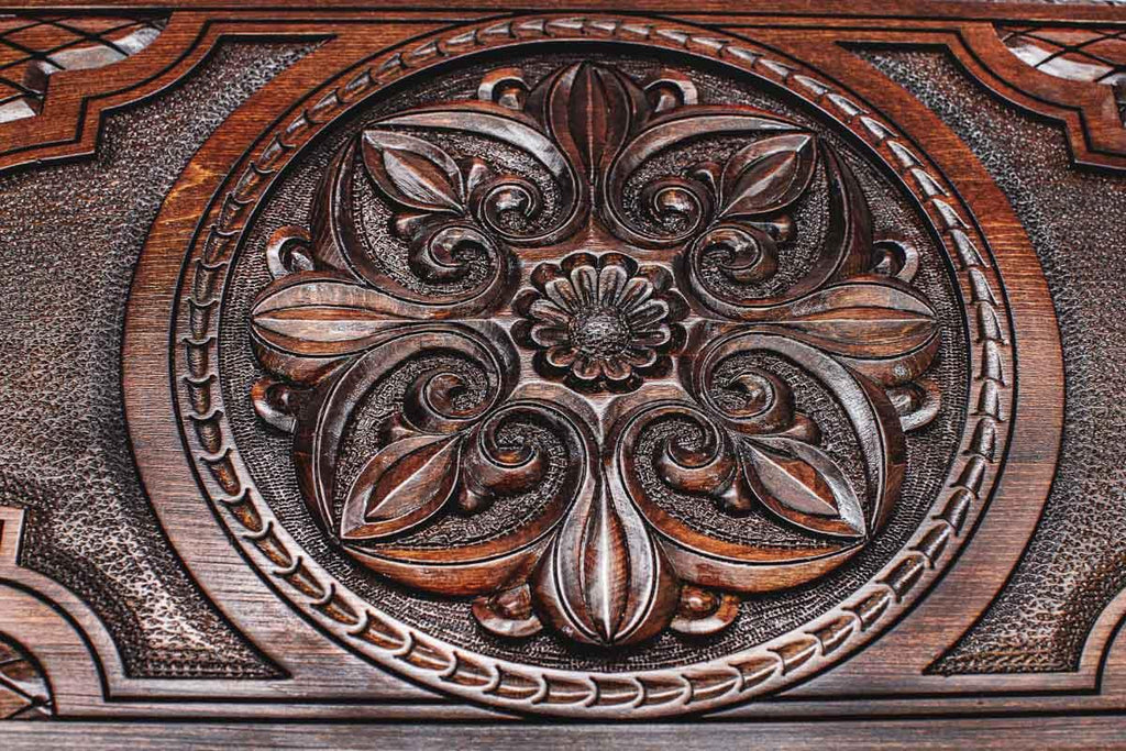 Deep relief flower ornament close-up, hand-carved in beech