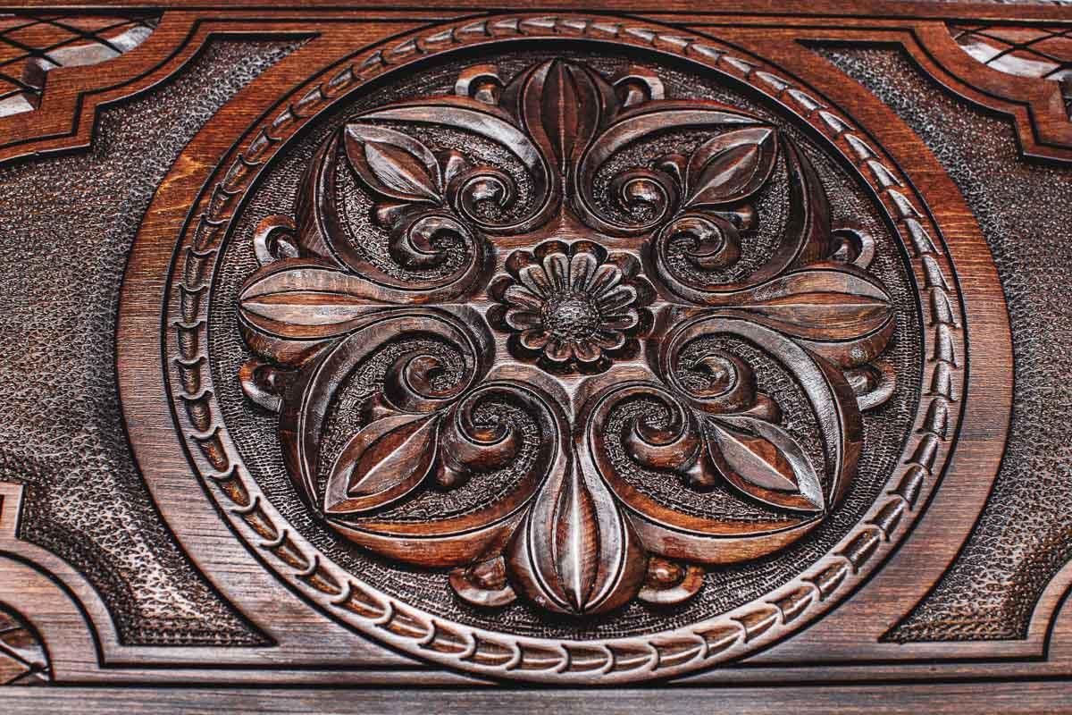 Deep relief flower ornament close-up, hand-carved in beech