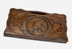 Carved beechwood backgammon board with a prowling wolf and carry handle, propped open