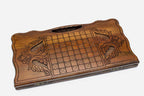 Angled view of the prowling wolf carved backgammon board